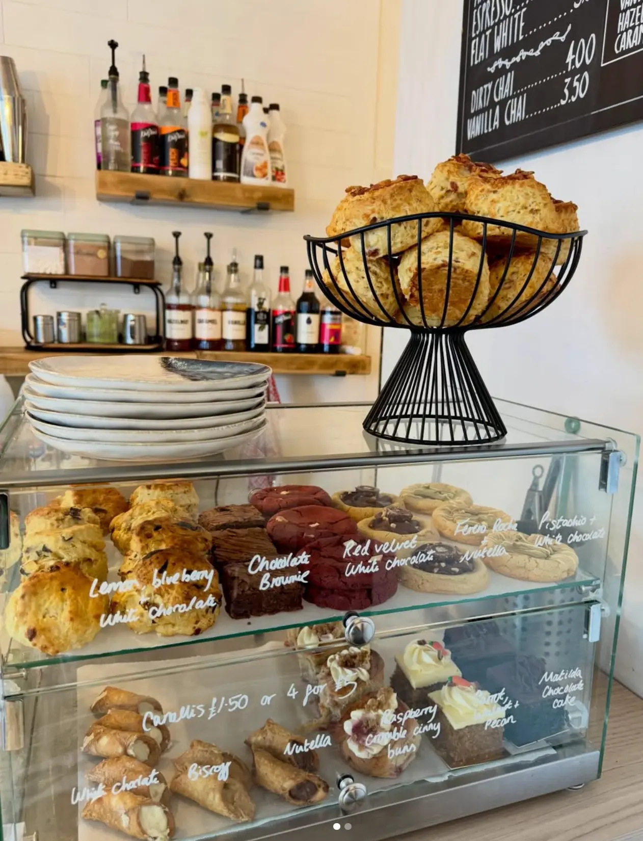 The Leaf + Bean counter display filled with scones, cookies, brownies, cannolis and cakes